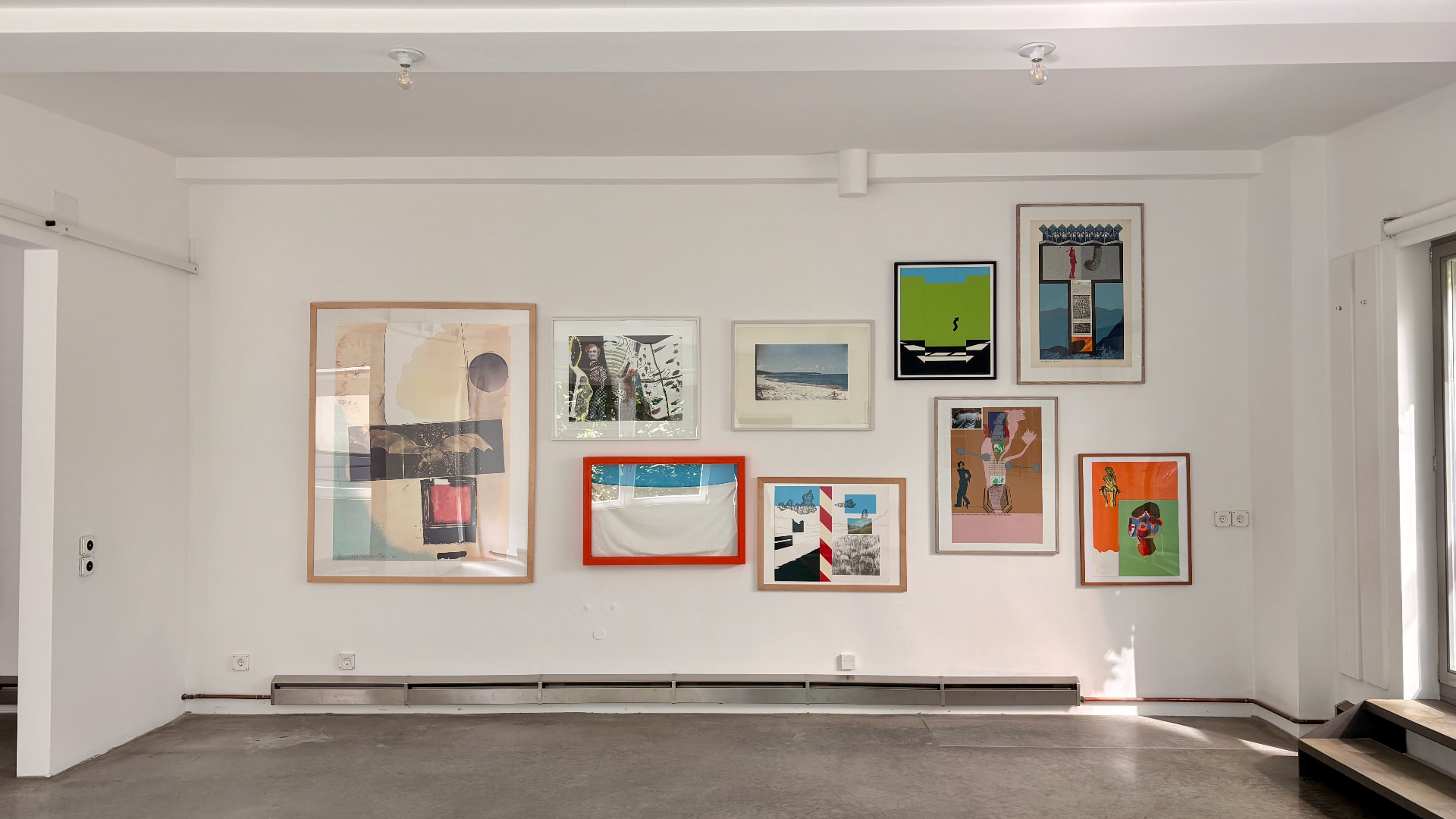 Installation view of The Spirit of Pop Art: wall of prints and collages