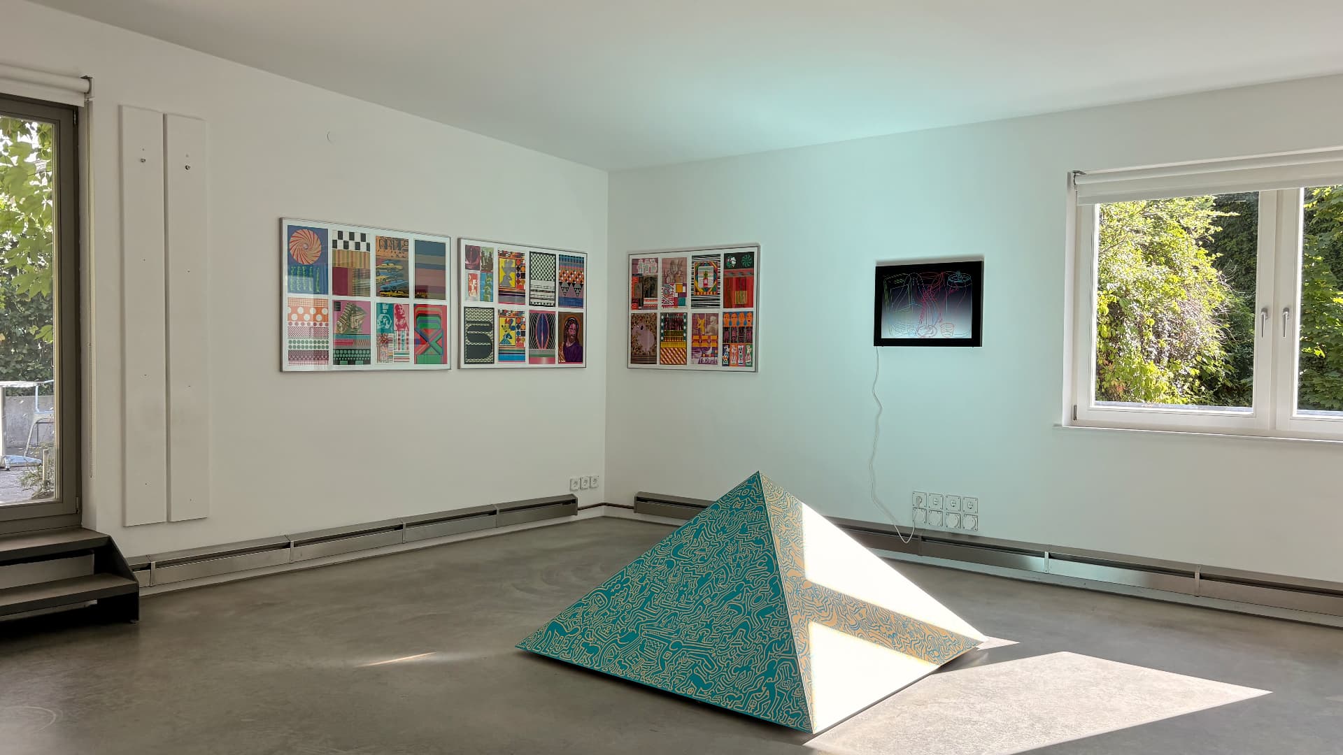 Installation view of The Spirit of Pop Art: room with a pyramid sculpture
